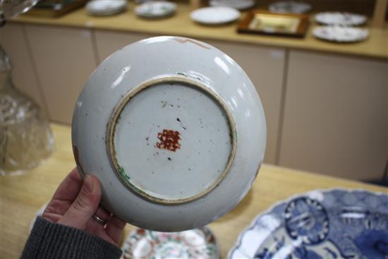 A near set of six 19th century Chinese famille rose saucer dishes, each painted with fruit and shou characters, diameter ranging 16.3cm